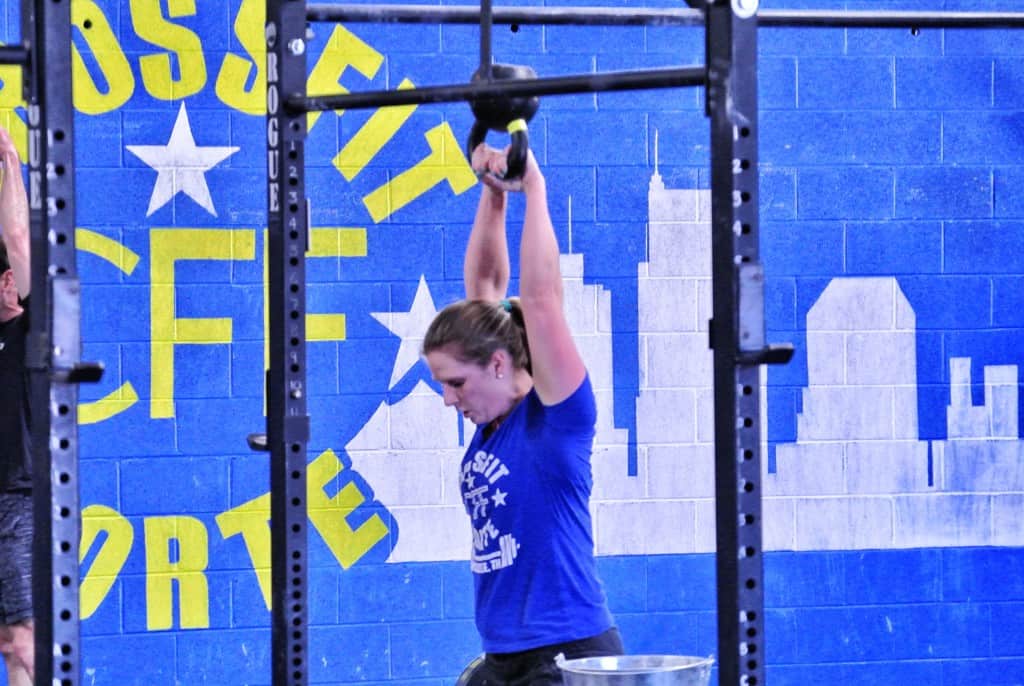 LeeAnn demonstrating the proper overhead position for the KBS. Arms fully extended, bottom of the bell upside down, head through, hips and legs extended (can't see that part but we'll assume she's doing it ;-)